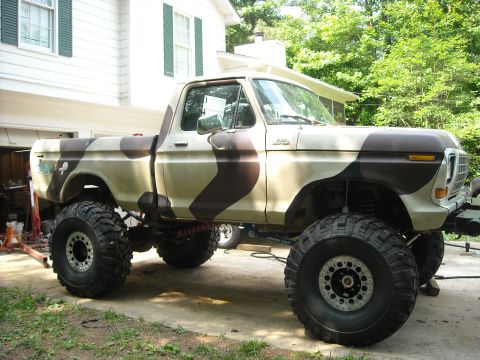 1979 Ford F-150 - This lifted 1979 Ford F-150 features a custom camouflage paint scheme and oversized off-road tires.