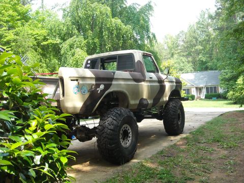 1979 Ford F-150 - This lifted 1979 Ford F-150 features a distinctive camouflage paint scheme and oversized tires.