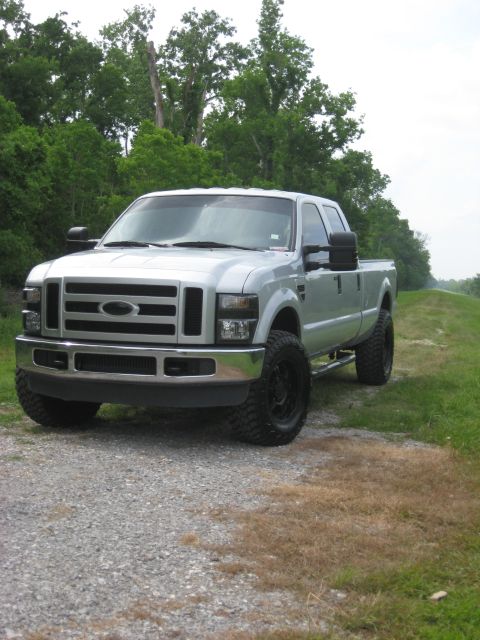 2008 Ford F-250 - Silver 2008 Ford F-250 pickup truck with aftermarket wheels and tires.