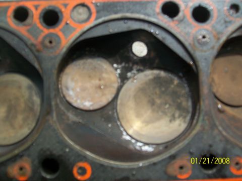 1972 Ford Ranchero - Close-up of an engine cylinder head, revealing internal components and wear patterns.