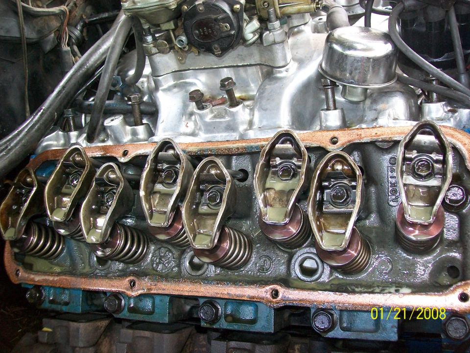 Engine valve train with rocker arms and springs visible
