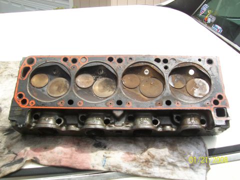 1972 Ford Ranchero - Close-up of an engine cylinder head, showing the combustion chambers and valves.