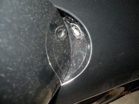 2000 Porsche Carrera - Detail of a car's body panel, possibly a wheel well liner or fender component.