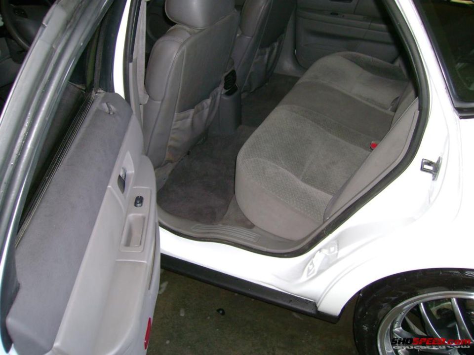 1993 Ford Taurus interior showing front passenger door panel and rear seats