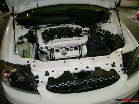 1993 Ford Taurus - The engine bay of a 1993 Ford Taurus SHO, its V6 engine with custom white intake piping.