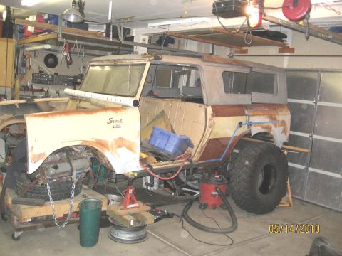 1961 International Scout 800 - International Scout 800 in garage with bodywork in progress, showing "Scout" badge.
