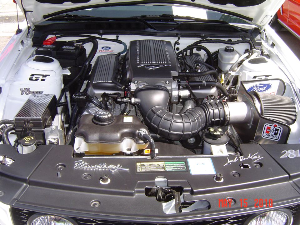 Ford Mustang engine with GT and V8 badges, Superchargers, and Jack Roush signature