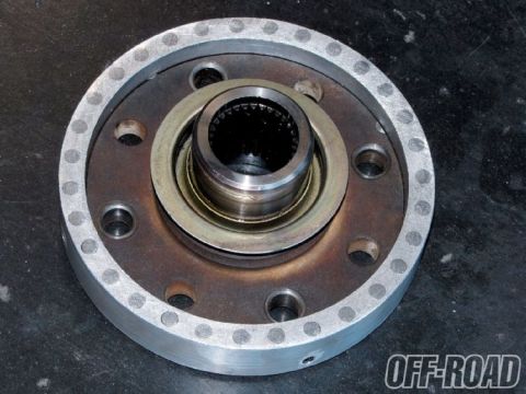 1990 Ford Bronco - This is a close-up view of a metal automotive part, likely a hub or flange.
