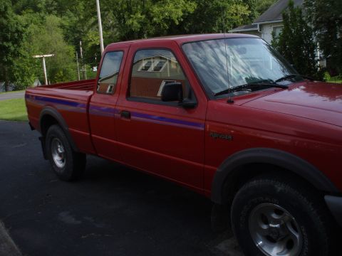 1997 Ford Ranger - 1997 Ford Ranger XLT extended cab pickup truck parked on asphalt.