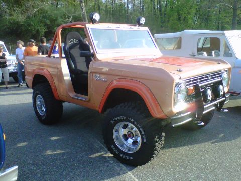 1995 Ford Bronco - This modified Ford Bronco features racing seats and aggressive off-road tires, suggesting it's built for more than just casual driving.