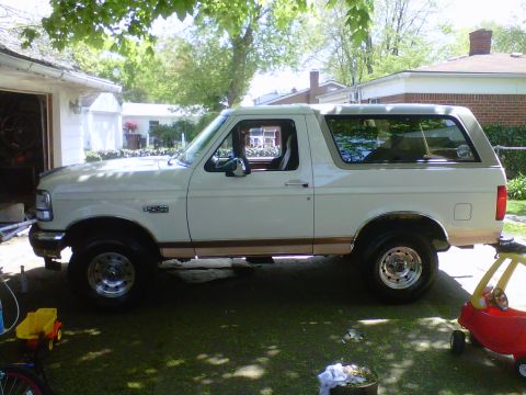1995 Ford Bronco - This 1995 Ford Bronco is parked in a residential driveway on a sunny day.