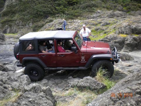 1994 Ford Explorer - Jeep Wrangler navigating a rocky coastal path on May 15, 2010.