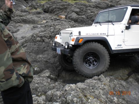 1994 Ford Explorer - A white Jeep Wrangler Rubicon tackles a challenging rocky path on May 15, 2010.