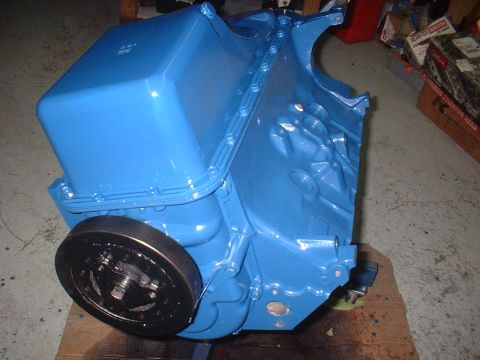 1969 Ford Torino - A freshly painted blue engine block sits on a wooden surface, ready for installation.