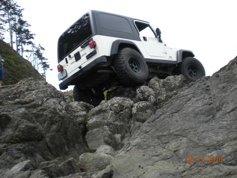 1994 Ford Explorer - A white Jeep Wrangler navigates a rocky coastal terrain on May 15, 2010.