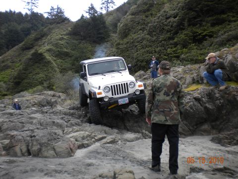 1994 Ford Explorer - A white Jeep Wrangler navigates a rocky coastal path on May 15, 2010.