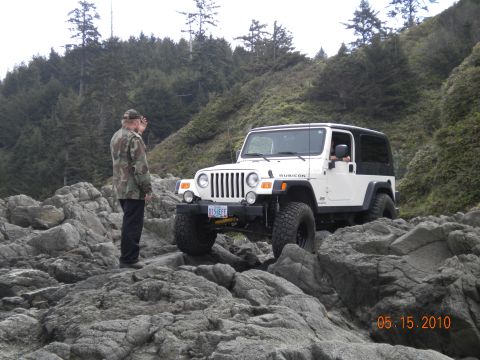 1994 Ford Explorer - White Jeep Wrangler Rubicon navigates a rocky coastal trail on May 15, 2010.