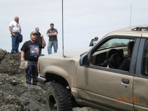 1994 Ford Explorer - A 1994 Ford Explorer is seen off-road with a group of people gathered around.