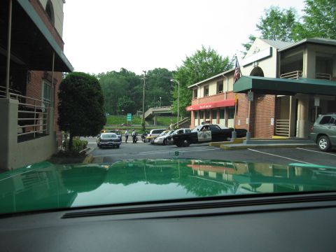 1991 Ford Crown Victoria - Multiple police vehicles and civilian cars are visible in a parking lot scene.