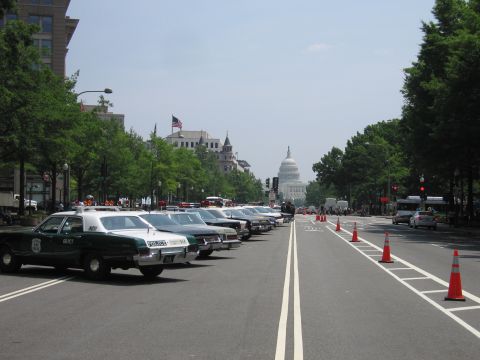 1991 Ford Crown Victoria - Police cars are lined up on a street with the US Capitol building visible in the distance.