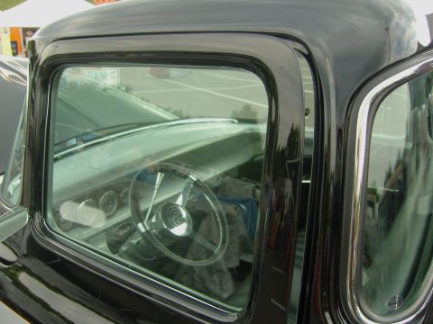 2007 Ford Mustang - Interior view of a classic black pickup truck, focusing on the steering wheel and dashboard details.