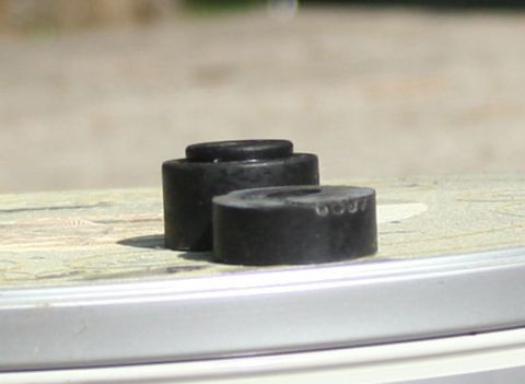 1976 Ford Ranchero - Close-up of two rubber suspension bushings, one marked with '6007'.
