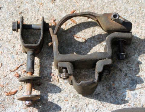 1976 Ford Ranchero - Two old suspension parts shown on a concrete surface.