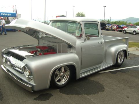 2007 Ford Mustang - This customized 1956 Ford F-100 pickup truck features a prominent red engine under its open hood.