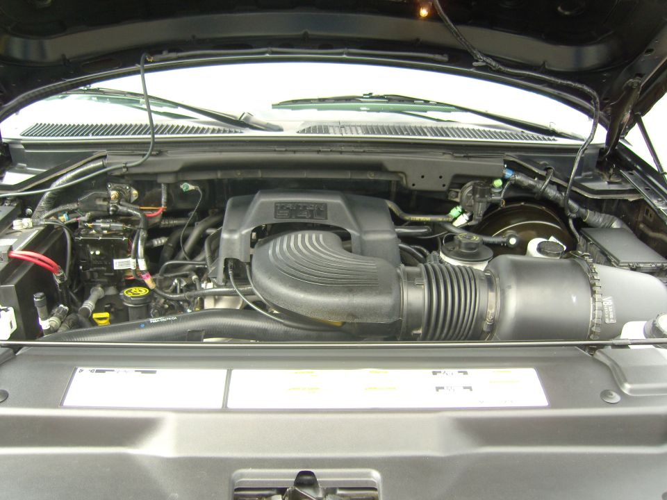 Engine bay of a Ford F-150 truck, likely from the 2004-2008 generation