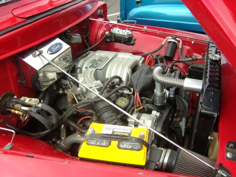 2007 Ford Mustang - Engine bay view of a Ford 5.0L V8 engine, likely from a Mustang or similar model.