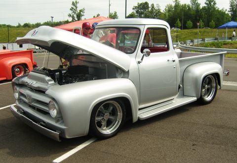 2007 Ford Mustang - Silver 1956 Ford F-series pickup truck with custom wheels and lowered suspension.
