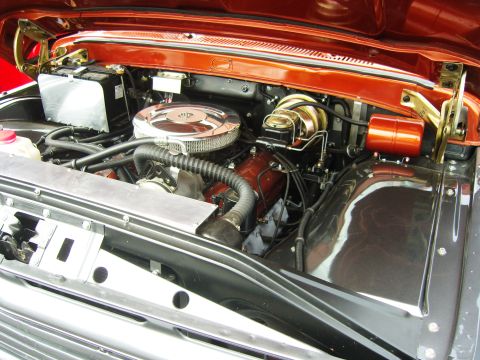 2007 Ford Mustang - Close-up view of a vehicle's engine bay, showing various mechanical components and wiring.