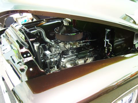 2007 Ford Mustang - Detailed view of a polished V8 engine, likely from a classic vehicle, with chrome accents and an exposed air filter.