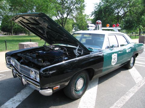 1991 Ford Crown Victoria - This police car, marked "69 PCT", has its hood open, revealing the engine compartment.