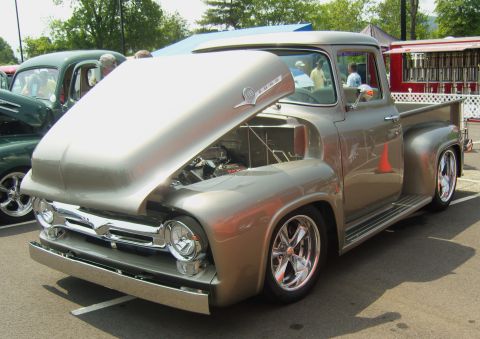 2007 Ford Mustang - Customized 1956 Ford F-series pickup truck on display at a car show.
