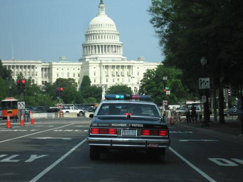 1991 Ford Crown Victoria - A highway patrol car is seen from behind with the US Capitol building in the background.