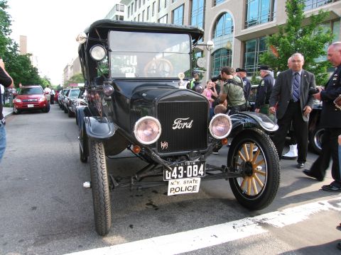 1991 Ford Crown Victoria - A vintage Ford Model T, identified by its 1919 badge, is displayed with a New York State Police license plate.