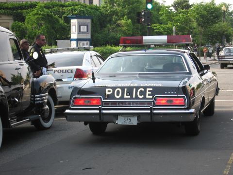 1991 Ford Crown Victoria - This police car, marked 'UNITED STATES CAPITOL POLICE', is seen from the rear with a license plate displaying '375'.