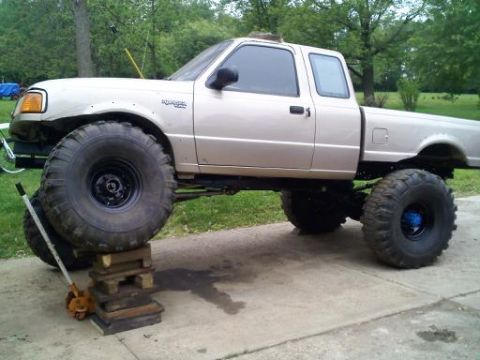 1997 Ford Ranger - This lifted Ford Ranger is propped up on blocks, its massive tires and suspension.