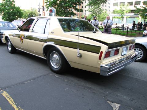 1991 Ford Crown Victoria - This Chevrolet Caprice police car displays Maryland State Police markings and a light bar.
