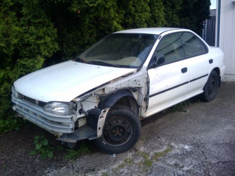 1998 Subaru Legacy - This 1998 Subaru Impreza sedan is missing its driver's side front fender and bumper.