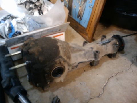 1998 Subaru Legacy - Differential housing part, possibly from a Subaru, shown on a concrete floor.