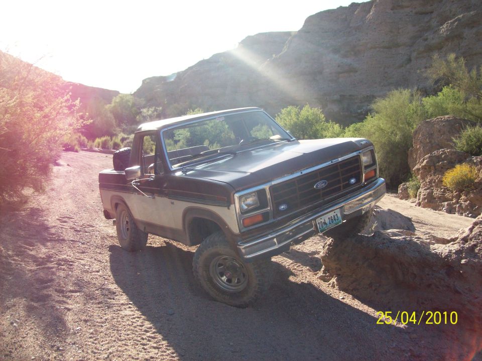 Ford F-Series truck on a dirt road in a canyon