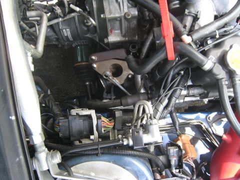 2007 Subaru Impreza - Close-up view of a complex engine bay, showing numerous hoses, wires, and mechanical parts.