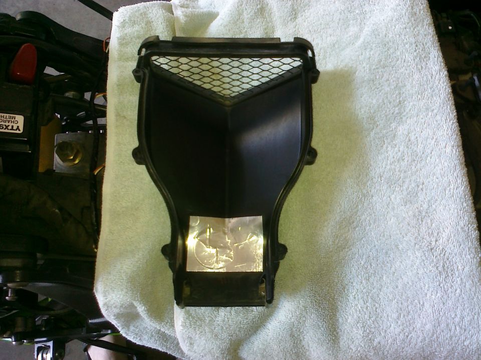 Motorcycle air intake cover with mesh screen and reflective sticker