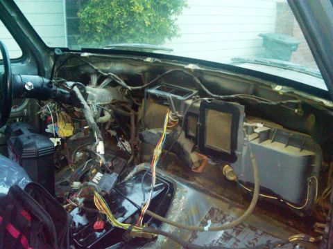 1986 Ford Bronco - The interior of a 1986 Ford Bronco shows a disassembled dashboard with extensive wiring exposed during a repair or modification.