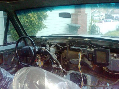 1986 Ford Bronco - Interior view of a 1986 Ford Bronco with the dashboard disassembled for service.