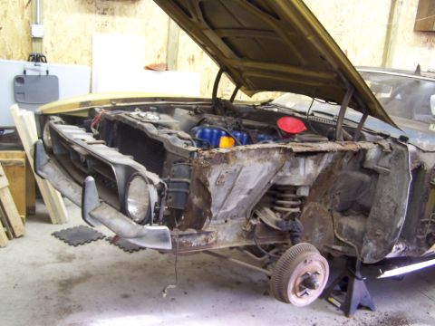 1972 Ford Mustang - This 1972 Ford Mustang shows significant rust damage to its front end and engine compartment.