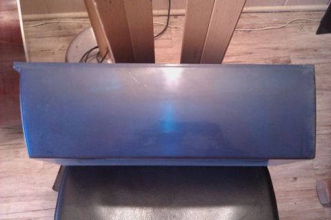 1991 Ford Crown Victoria - A blue car bumper part is shown from an overhead angle.