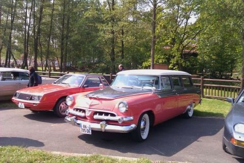 1991 Ford LTD Crown Victoria - This vintage station wagon, likely from the mid-1950s, is parked outdoors with other vehicles.